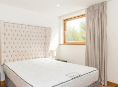 Designer headboard with linen upholstery