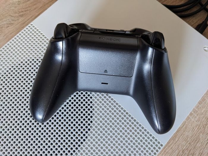 Xbox One S 1TB with controller and cables.
