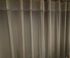 Grey velvet eyelet curtains
