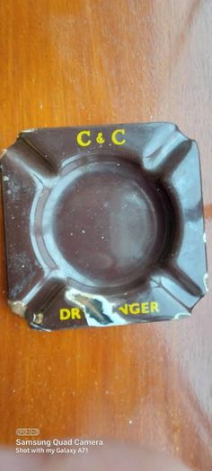 C & C Dry Ginger "ale" enamel metal ashtray ,dark brown,  very old vintage advertising ashtray, hard to come by ,collectors item,used condition  see pictures