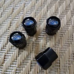 Brand New Subaru Black Metal Dust Caps x4