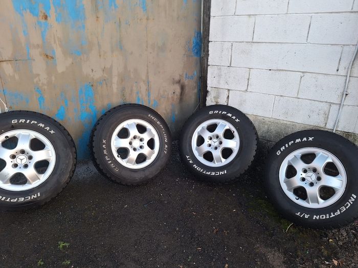 Tires with aluminum rims 265/70/17. A/T