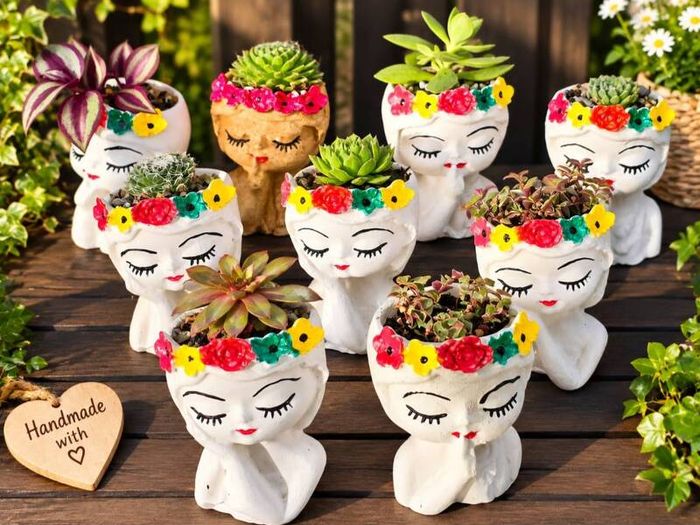 small handmade flower pots with real plants