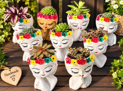 small handmade flower pots with real plants