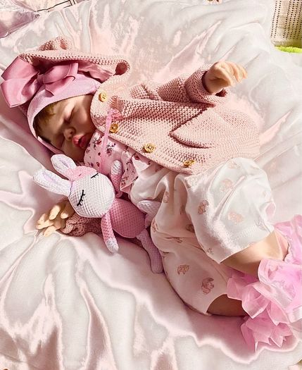 doll.       Reborn baby doll very cute COMES WITH A XMAS OUTFIT
