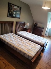 2 single beds with mattresses