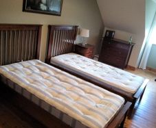 2 single beds with mattresses