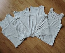 White vests  Age 11-12