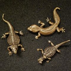 3 brass lizards.