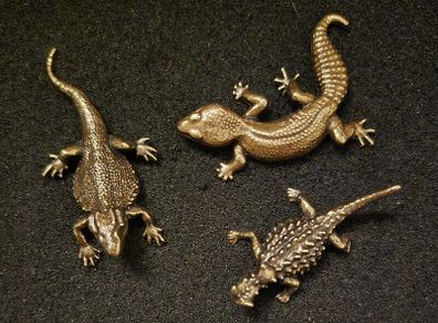 3 brass lizards.