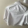 3 dunnes white shirts (new/as new) age 6-7 Image 8