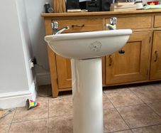 Sink, pedestal with hot and cold taps