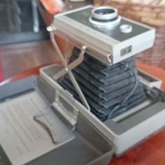 Polaroid 330 camera with instructions