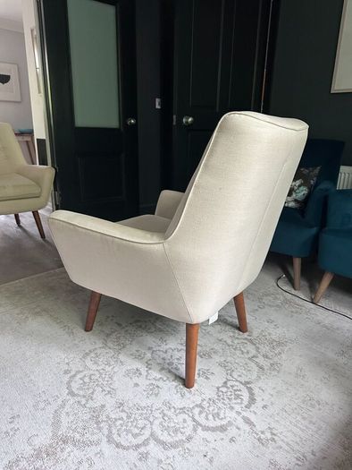 Two creme stylish armchairs
