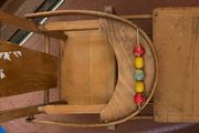 Vintage wooden doll high chair FROM THE 1930S featuring a built-in play tray with a wire bead
