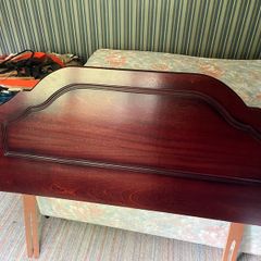 The quarter bed headboard in attractive dark wood