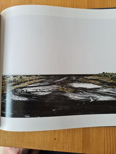 Under A GREY Sky. By Simon Burch. This Book Of Photos  Follows The landscape,people, & Towns Affected By The Collaps Of Board Na Mona's Peat Mining  Industry. IN IRELAND.