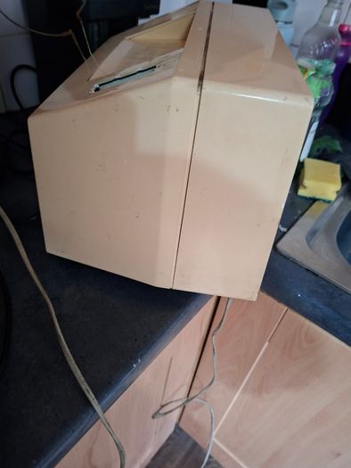 Ideal Prop, Vintage Working Boots Audio TV12 Portable Black and White CRT Television, featuring a cream plastic casing with side control dials and a 12 inch screen. Designed with dual power capabilities supporting standard mains voltage (240V) as well as 