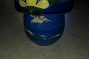 Blue cup and lid hand panted pottery.