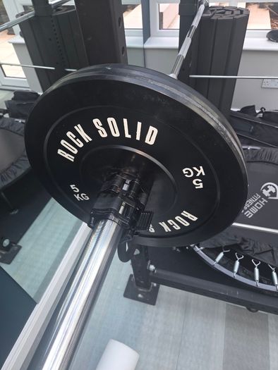 Mint condition - amazing heavy duty black squat rack with almost brand new Rock Solid barbell and bumper plates - a must see!!!