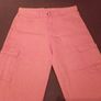 Orange cargo trousers. Image 9