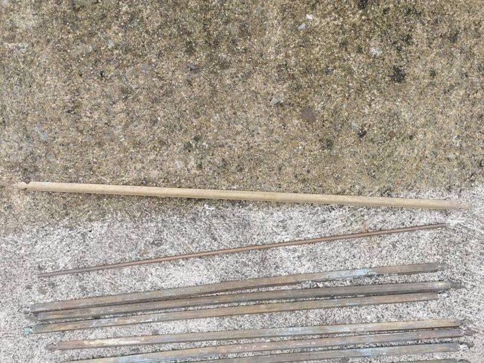 A set of old brass staire rods