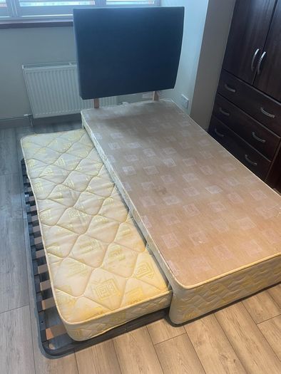 Single bed frame with guest mattress and headboard