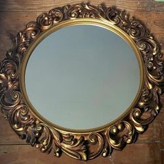 Vintage ornate gold mirror