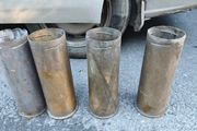 four empty brassartillery shell casings