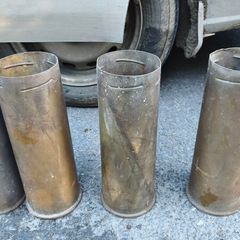 four empty brassartillery shell casings
