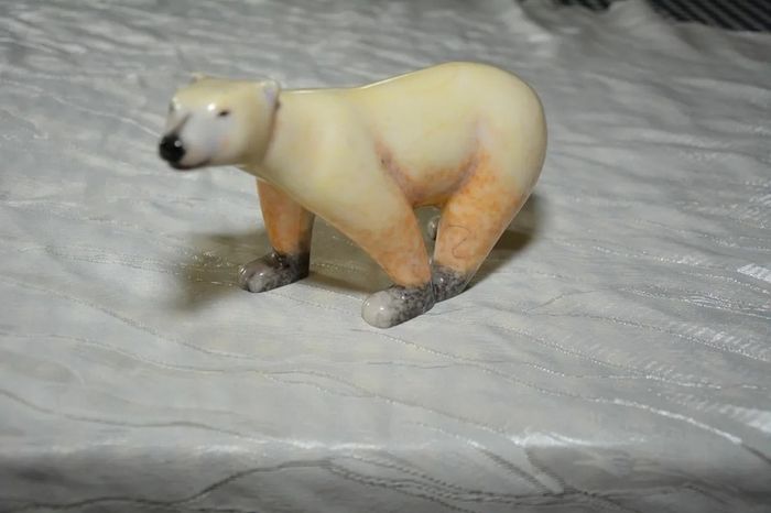 Stone sculpture of a white polar bear