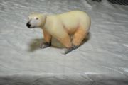 Stone sculpture of a white polar bear