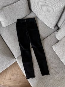 Black skinny ripped knee jeans