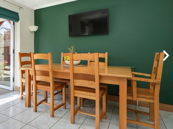 Solid Wooden Dining Table and Matching Chairs