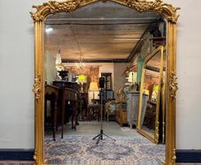 Ornate French Style Carved Scroll Mirror in Gilt Finish