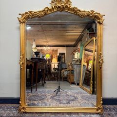 Ornate French Style Carved Scroll Mirror in Gilt Finish