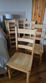 Six solid wood chairs.