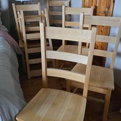 Six solid wood chairs.