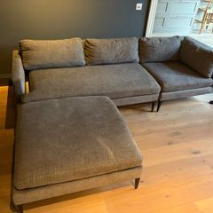 West Elm sofa with matching footstool