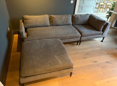 West Elm sofa with matching footstool