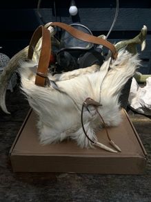 1 Handcrafted Goat Skin Bag with Long Leather Shoulder Strap and an Antler Toggle