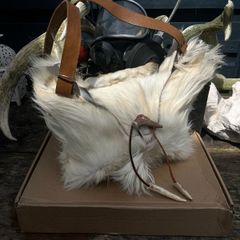 1 Handcrafted Goat Skin Bag with Long Leather Shoulder Strap and an Antler Toggle