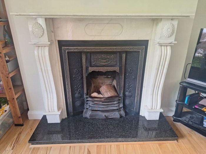 Castiron fireplace and surround plus marble mantlepiece and black stone heart