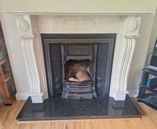 Castiron fireplace and surround plus marble mantlepiece and black stone heart