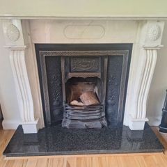 Castiron fireplace and surround plus marble mantlepiece and black stone heart