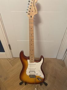 sunburst squier Stratocaster with case and whammy bar