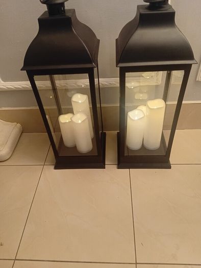 Floor lanterns standing 27 ins high and 21 ins width
