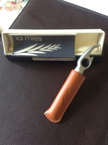 Corkscrew/ Bottle opener in Leather case.