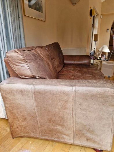 brown leather sofa and arm chair