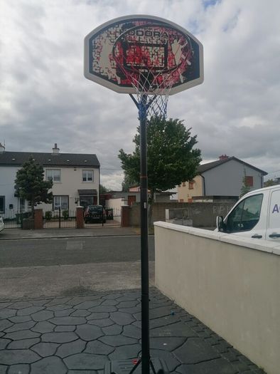 Basketball stand and two basketballs